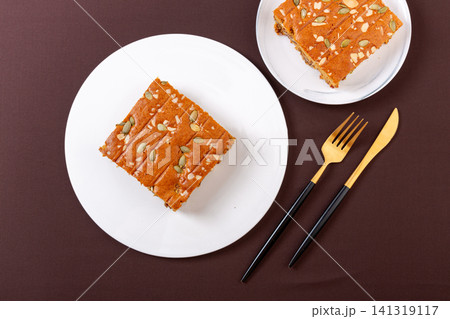 sliced jujube brown sugar cake topped with mixed nuts and seeds sliced jujube brown sugar cake topped with mixed nuts and seeds 141319117