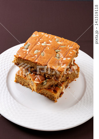 sliced jujube brown sugar cake topped with mixed nuts and seeds sliced jujube brown sugar cake topped with mixed nuts and seeds 141319118