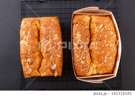 slice of golden pillow cake with red date flavor and sliced almond topping slice of golden pillow cake with red date flavor and sliced almond topping 141319185