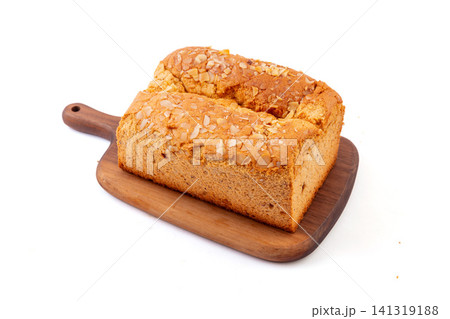 slice of golden pillow cake with red date flavor and sliced almond topping slice of golden pillow cake with red date flavor and sliced almond topping 141319188