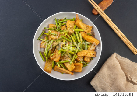 chinese Stir-Fried Fried Tofu with Garlic Scapes, Sauteed Bean Curd chinese Stir-Fried Fried Tofu with Garlic Scapes, Sauteed Bean Curd 141319391