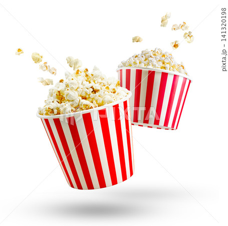 Popcorn in red and white striped box and flying out grains isolated on white or transparent background Popcorn in red and white striped box and flying out grains isolated on white or transparent background 141320198