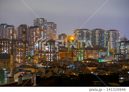 View of turkish residential buildings with fast illuminated windows at night 141320946