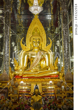 Golden Buddha sculpture sitting in spectacular mirror hall with silver glass pillars, Thailand landmark. Golden Buddha sculpture sitting in spectacular mirror hall with silver glass pillars, Thailand landmark. 141322914