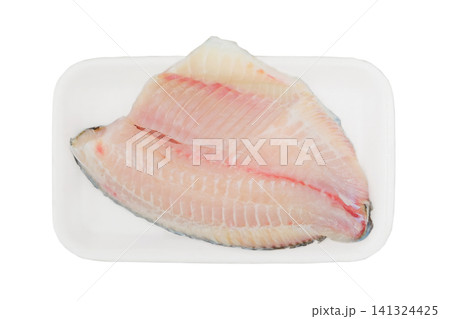 Raw Dorado fish fillet in white container isolated on a white background. Ready to cooking. Top view. Raw Dorado fish fillet in white container isolated on a white background. Ready to cooking. Top view. 141324425