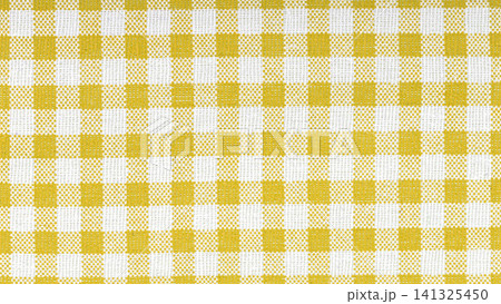 Yellow and white checkered cotton fabric texture close up Yellow and white checkered cotton fabric texture close up 141325450
