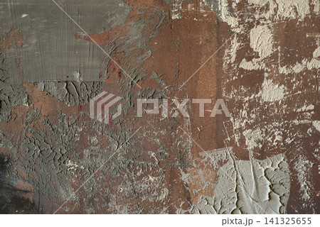 Abstract brown and grey textured background with rough plaster smears, scratches, and distressed grunge effect. Abstract brown and grey textured background with rough plaster smears, scratches, and distressed grunge effect. 141325655