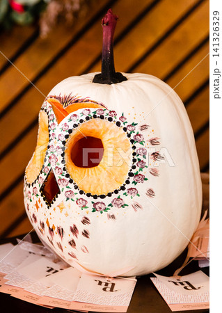 pumpkin in the form of an owl, an owl carved from a pumpkin, into a halloween pumpkin in the form of an owl, an owl carved from a pumpkin, into a halloween 141326329