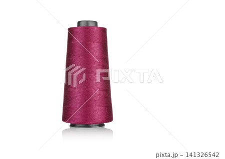 spool of industrial thread red, texture of thread on a white background spool of industrial thread red, texture of thread on a white background 141326542