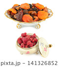 Assorted Dried Fruits and Fresh Raspberries in Ceramic Bowls Healthy Mix of Dried Apricots Dates and Berries Isolated on White 141326852