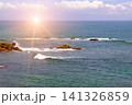 Beautiful Ocean Landscape with Rocky Reefs at Bright Sunset Scenic Sea Horizon with Crashing Waves and Sun Flare 141326859