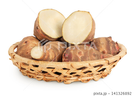 Jerusalem artichoke in a wicker basket isolated on white background Jerusalem artichoke in a wicker basket isolated on white background 141326892
