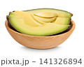 avocado piece in ooden bowl isolated on white background close up 141326894