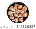 Brown champignon mushroom a ceramic bowl isolated on white background. Top view. Flat lay 141326897