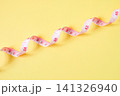 White color measuring tape on color background, top view. 141326940