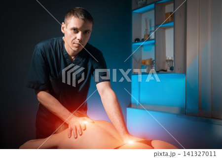 masseur making healing practice for woman spine masseur making healing practice for woman spine 141327011