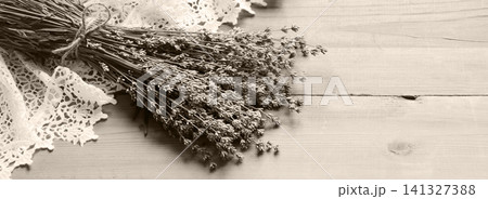 Lavender flowers lie on the table on lace Lavender flowers lie on the table on lace 141327388