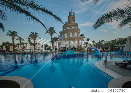 Bodrum, Turkey -June 4 2026: Selectum collection Bodrum is a 5 star all inclusive resort located in Akyarlar Turkey . Picture showing the prominent tower structure at the main pool area, Daylight shot Bodrum, Turkey -June 4 2026: Selectum collection Bodrum is a 5 star all inclusive resort located in Akyarlar Turkey . Picture showing the prominent tower structure at the main pool area, Daylight shot 141327804