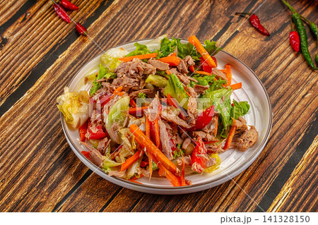 Tuna salad with lettuce carrot and pepper on wooden table Tuna salad with lettuce carrot and pepper on wooden table 141328150