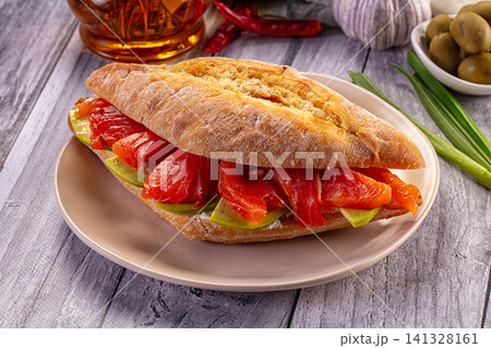 Smoked salmon sandwich with avocado on rustic bread Smoked salmon sandwich with avocado on rustic bread 141328161