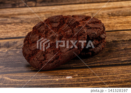 Chocolate cookies on rustic wooden surface Chocolate cookies on rustic wooden surface 141328197