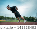 young athlete push up and jump at stadium outdoor 141328492