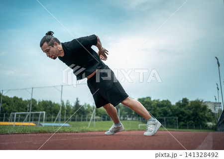 young athlete push up and jump at stadium outdoor young athlete push up and jump at stadium outdoor 141328492