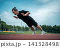 young athlete push up and jump at stadium outdoor 141328498