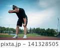 tired and exhauster runner on sport track outdoor 141328505