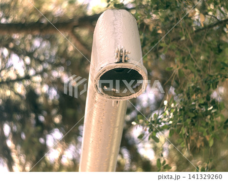 old lamp hanging on rope 141329260
