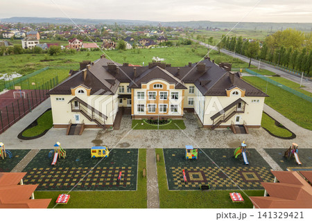 Aerial view of new prescool building in residential rural area. Aerial view of new prescool building in residential rural area. 141329421