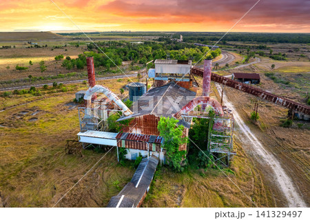Abandoned industrial site of Mosaic phosphate plant in Florida. Historic mining factory complex overtaken by nature. Abandoned industrial site of Mosaic phosphate plant in Florida. Historic mining factory complex overtaken by nature. 141329497