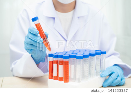 Scientist medical professional use test tube for research in science laboratory. 141333587