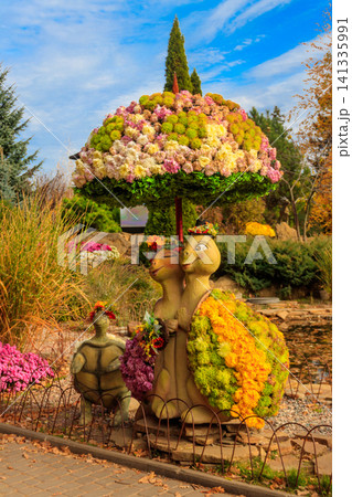 Turtles made of chrysanthemums in a park at autumn Turtles made of chrysanthemums in a park at autumn 141335991