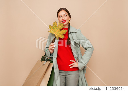 Autumn portrait of beautiful young woman 141336064