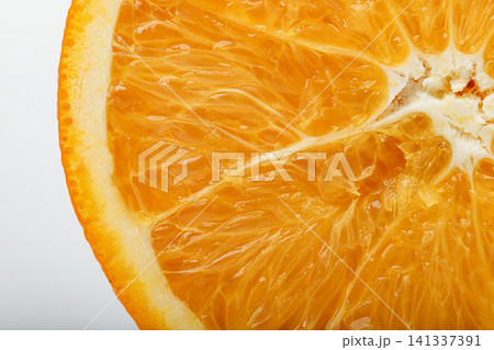 Macro of fresh orange flesh showing juicy citrus texture, natural patterns, and vibrant color, For food backgrounds, nutrition, and healthy lifestyle concepts 141337391
