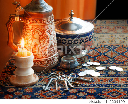 Still life with candle, keys and coins Still life with candle, keys and coins 141339109