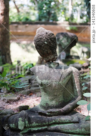 Ancient buddha statue in garden at Wat Umong is ancient temple in Chiang Mai of Thailand Ancient buddha statue in garden at Wat Umong is ancient temple in Chiang Mai of Thailand 141340608