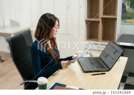 Businessmen are calculating income-expenditure and analyzing real estate investment data at office, Accounting Financial and tax systems concept. Businessmen are calculating income-expenditure and analyzing real estate investment data at office, Accounting Financial and tax systems concept. 141341884