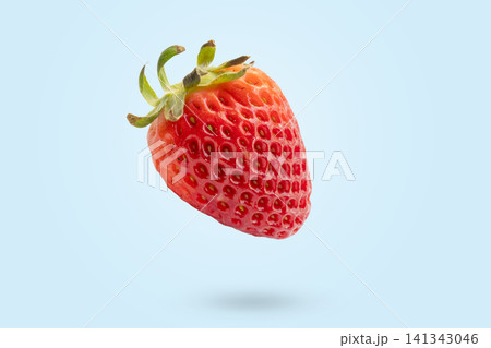 Strawberry floated on blue background close up Strawberry floated on blue background close up 141343046