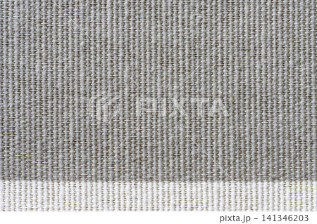 textured fabric with a prominent weave pattern 141346203