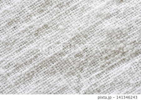 a white, textured fabric with a prominent woven pattern. a white, textured fabric with a prominent woven pattern. 141346243