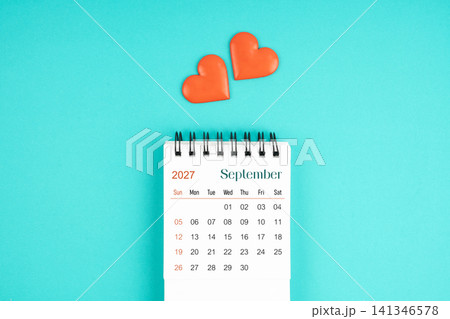 September 2027 desk calendar with red heart on blue color background. 141346578
