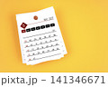 May 2027 calendar page with wooden push pin on yellow background. 141346671