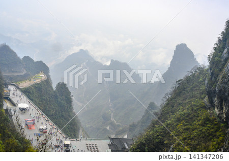 View of the Tumane observation deck in the Tianmenshan Mountains near Zhangjiajie city in China View of the Tumane observation deck in the Tianmenshan Mountains near Zhangjiajie city in China 141347206