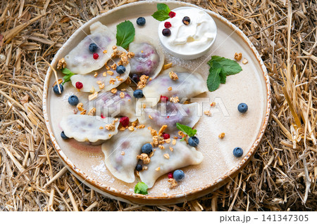 pierogi filled with blueberries pierogi filled with blueberries 141347305