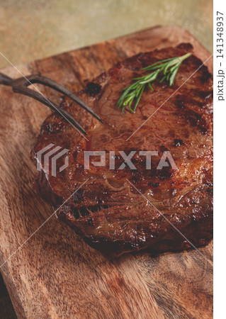 grilled steak, beef steak, rib eye steak, on a chopping board, top view, no people grilled steak, beef steak, rib eye steak, on a chopping board, top view, no people 141348937
