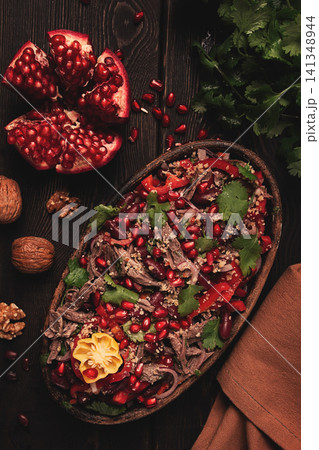 Georgian salad Tbilisi, boiled beef, with red beans and onions, sweet pepper, walnut and pomegranate, homemade, no people, 141348944