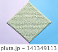 Copy space. Modern carpet in pastel colors on a white background. Home decor. Top view. 141349113