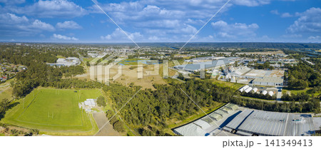 Drone aerial photograph of industrial buildings and a sports field Drone aerial photograph of industrial buildings and a sports field 141349413
